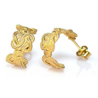 Mattenklopper oorbellen kopen | Mattenklopper oorbellen goud | Mattenklopper oorbellen betekenis